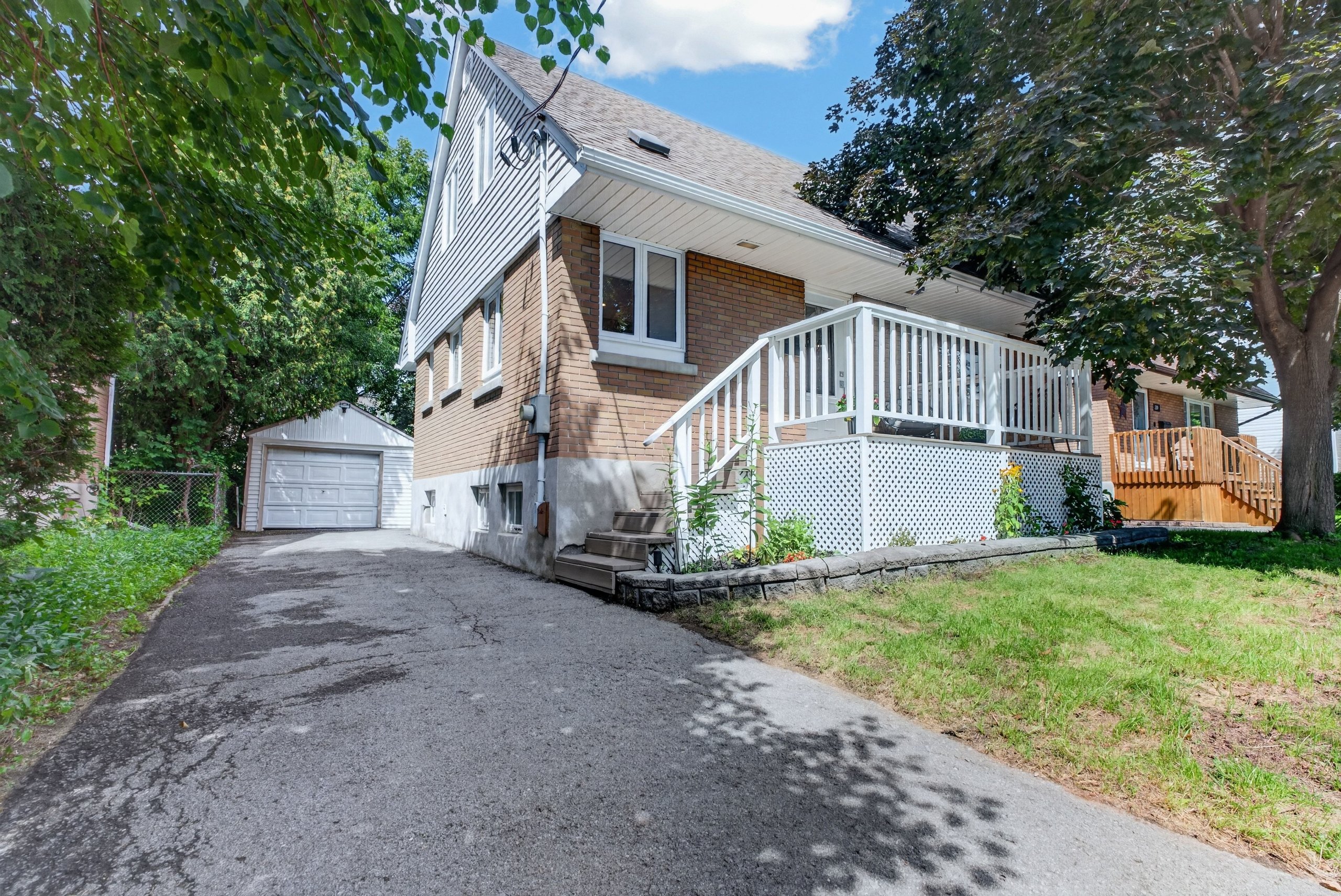 337 Joffre-Belanger Way, Vanier North — front exterior with driveway and detached garage